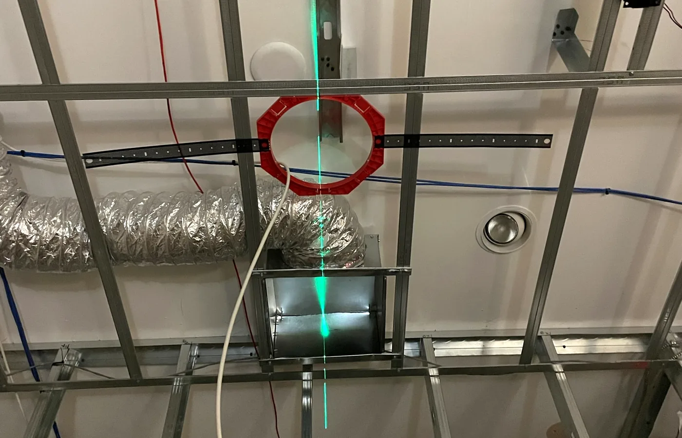 Speaker positions and cable runs set out against the grid