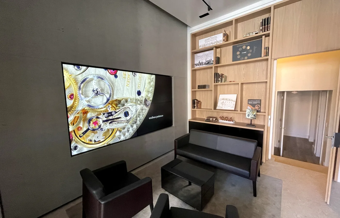 The video wall in the client lounge, alongside the display joinery