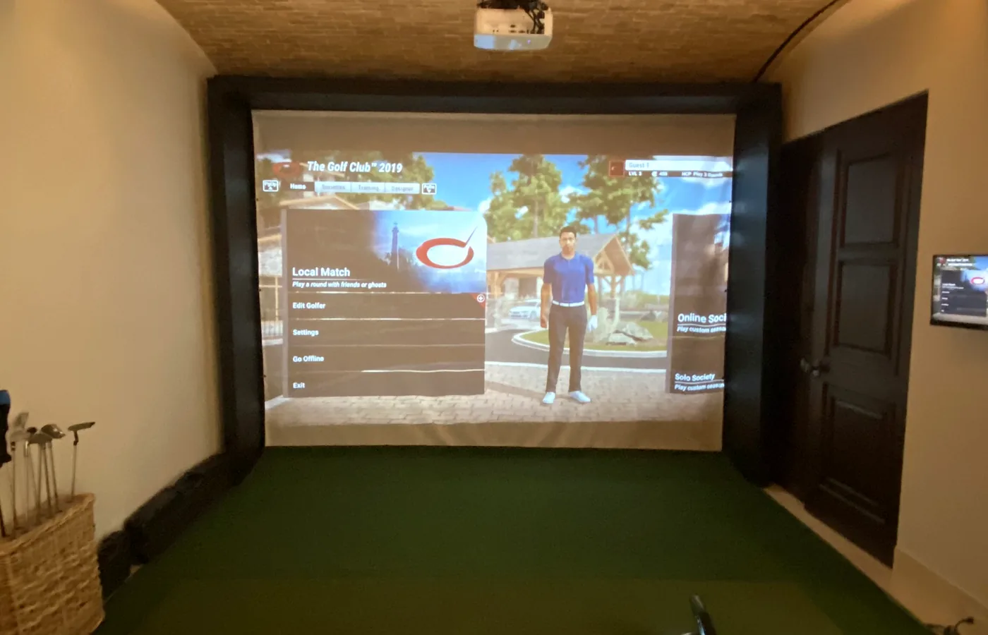 Projection and screen in the simulator room, under the brick vault