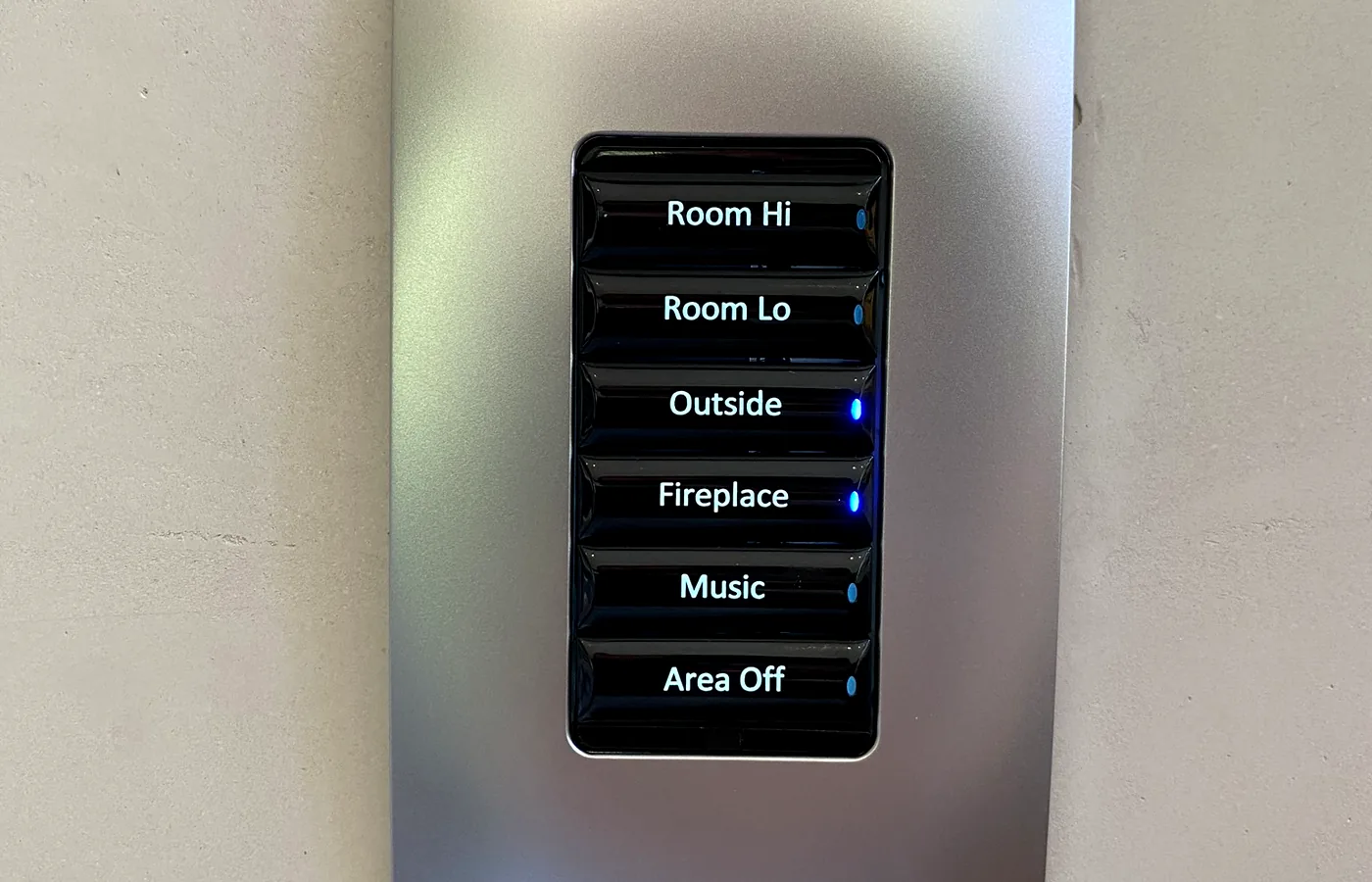 Six-button engraved keypad — the standard language through the house