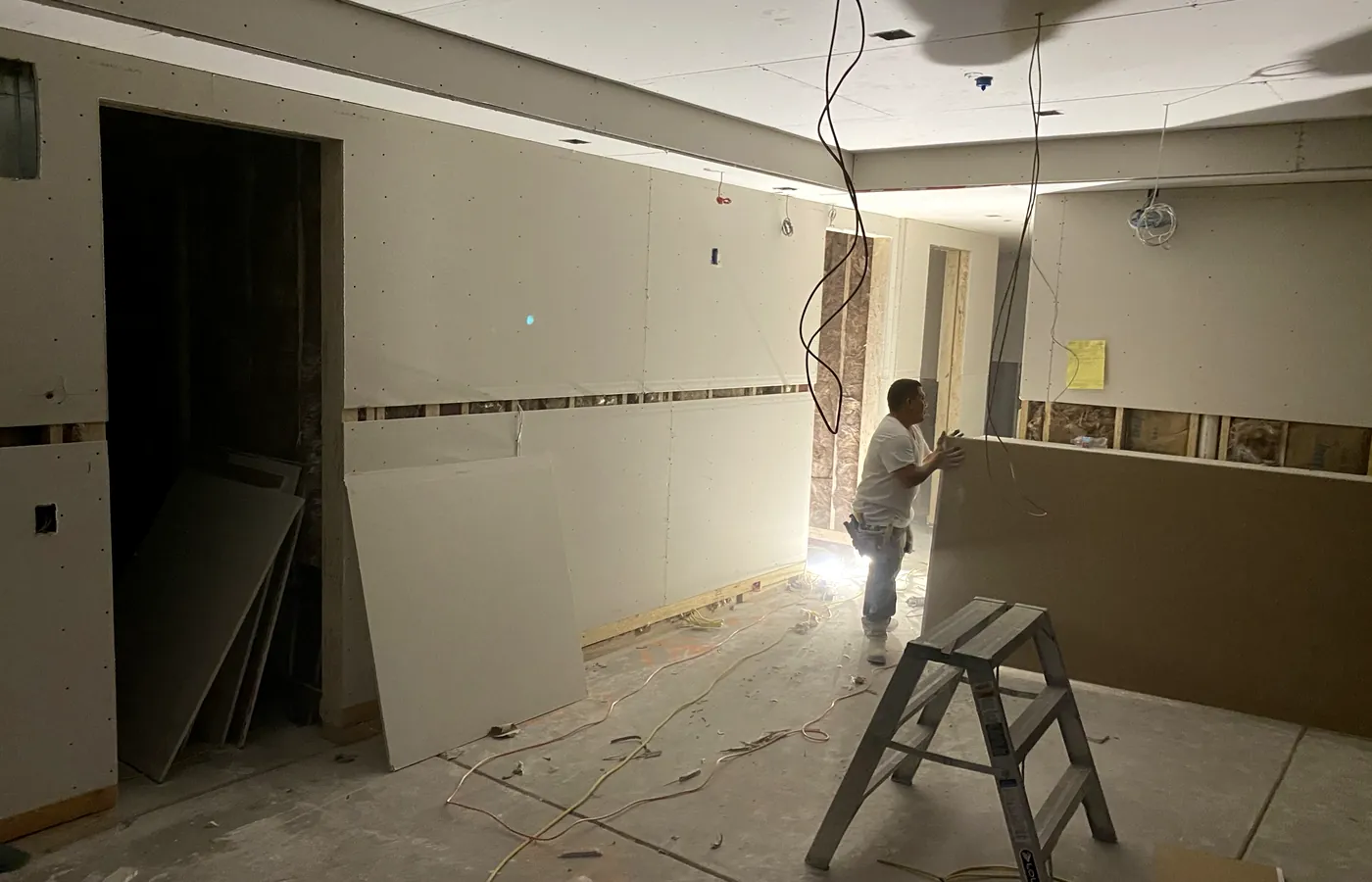 Rock going up, with back boxes and cable already terminated behind it