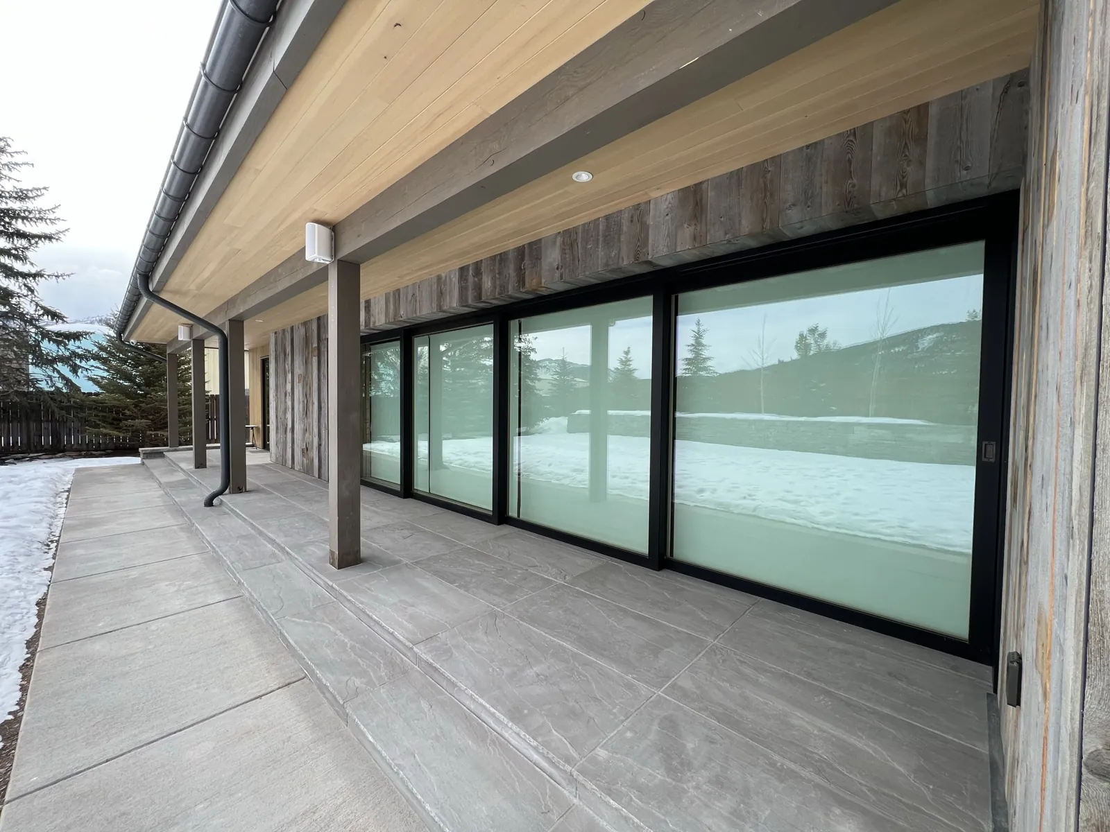 Shades lowered across the terrace elevation for privacy